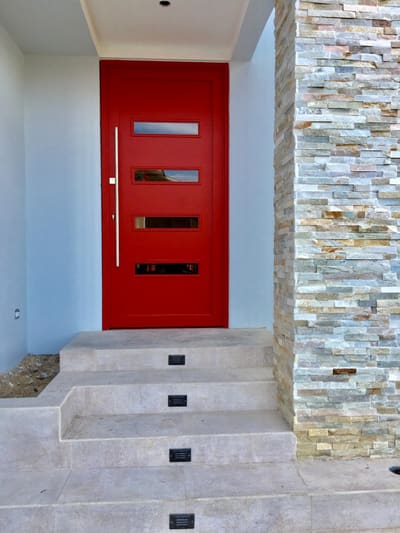 Red entrance door. Entry Doors by Nair Smart Solutions