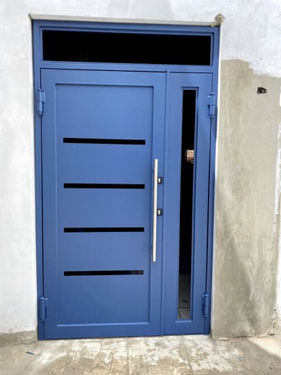 Blue door with transom. Entry Doors by Nair Smart Solutions