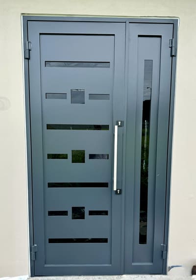 Grey door and sidelight. Entry Doors by Nair Smart Solutions