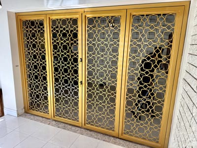 Gold lattice interior screens. Interior Screens by Nair Smart Solutions